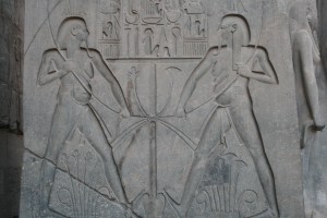 A double image of Ramses II (19th Dynasty - ruled 1279-1212 BC) holding the knotted lotus and pypyrus symbols of Upper and Lower Egypt